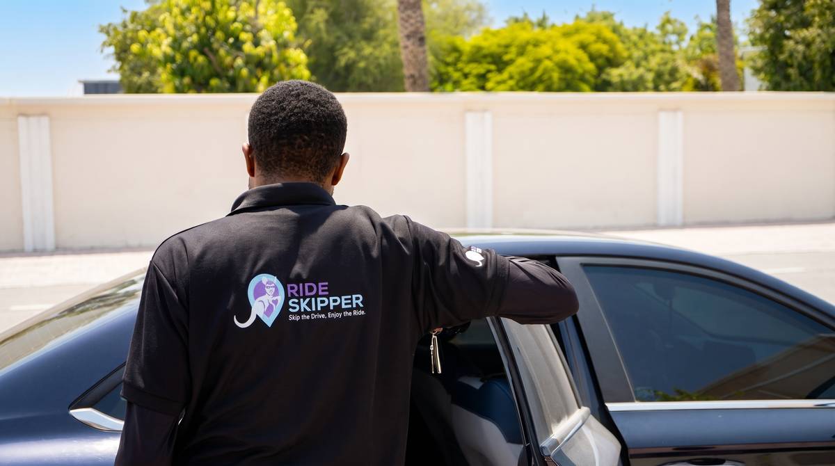 A Skipper opening the car door for a client